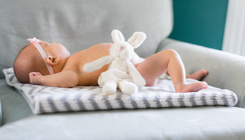 Infant with stuffed animal