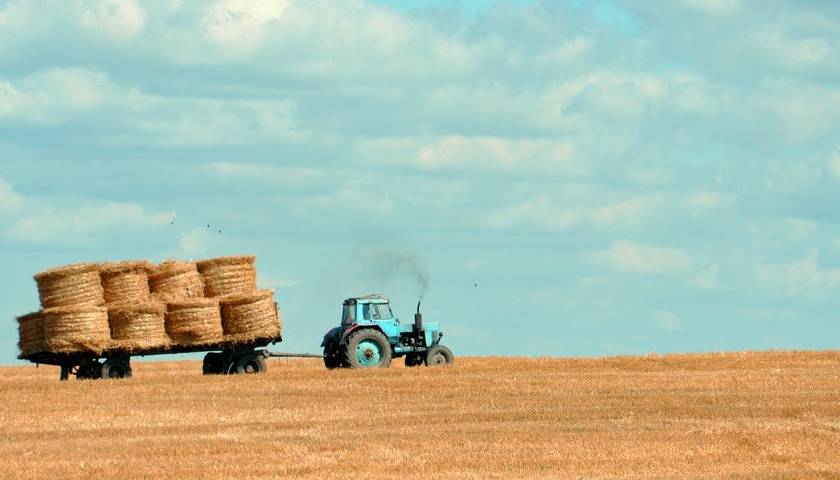 Tractor towing hay on a farm